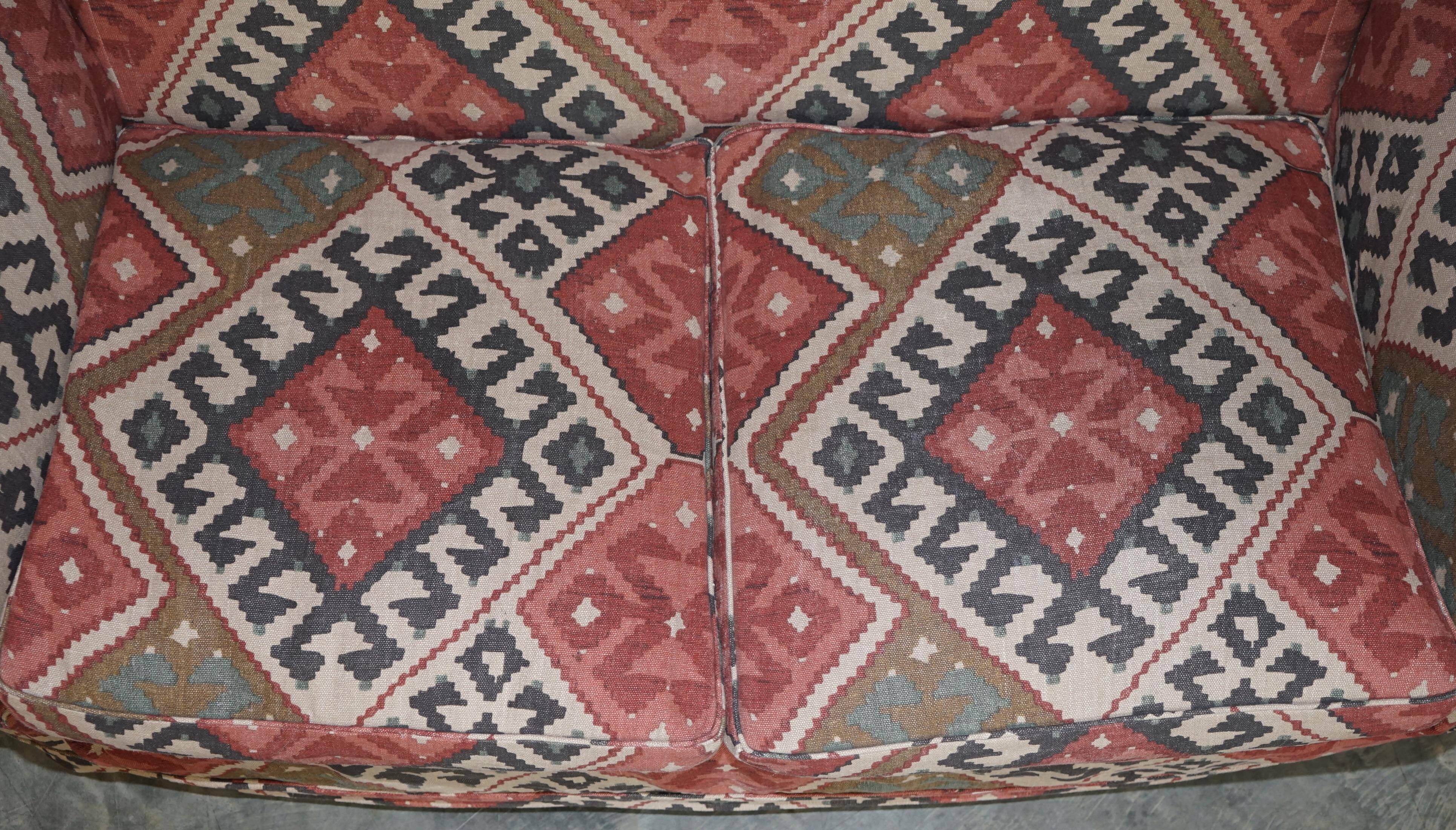 Victorian canapé upholstered in Kilim with turned mahogany legs.