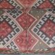 Victorian canapé upholstered in Kilim with turned mahogany legs.