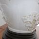 Pair of relief enameled porcelain lamps, Asian motif