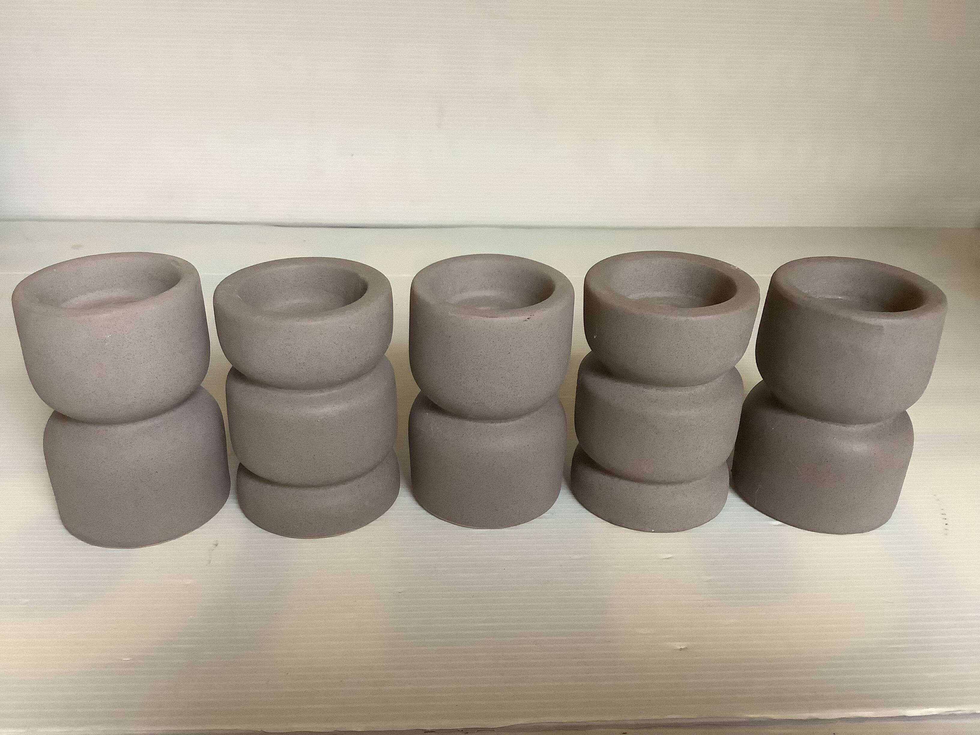 Five matte gray candle holders