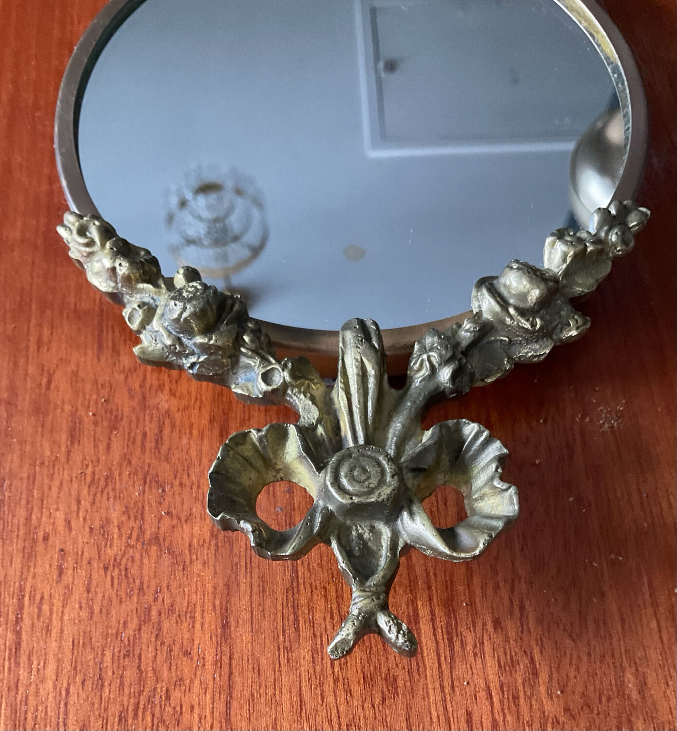 Antique small bronze mirror in Louis XIV style