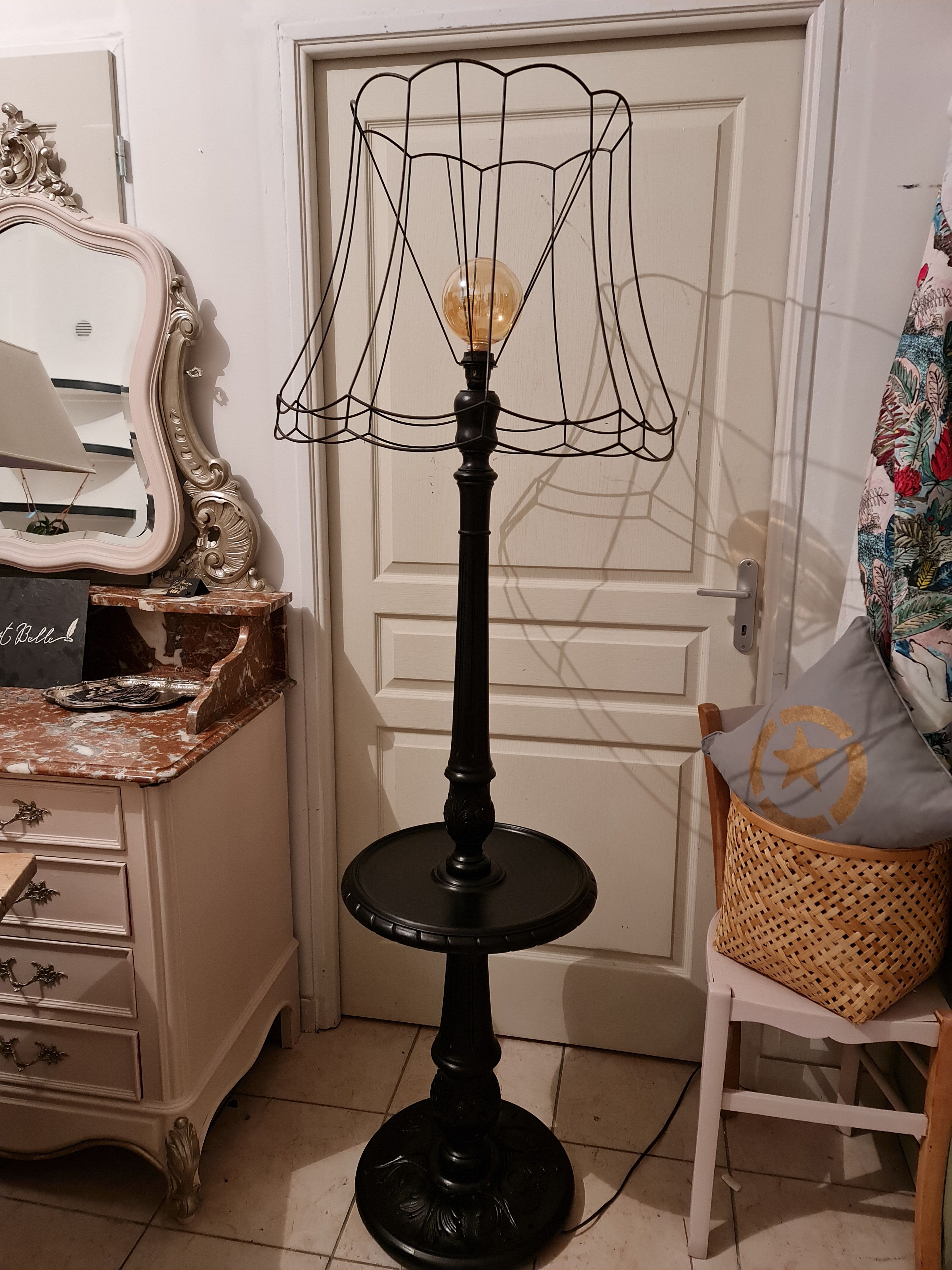 Matte black lamppost with small tablet