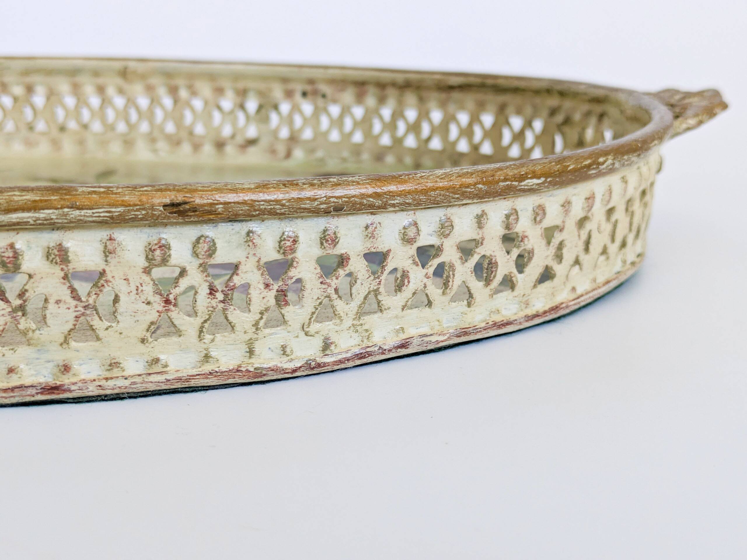 Oval metal decorative vintage tray with floral pattern.