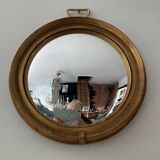 Vintage witch's eye mirror in gilded wood