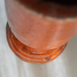 Orange glazed terracotta vase