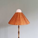 Brass floor lamp with rattan shade, 1950s-60s.