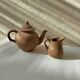 Teapot and small earthenware pot