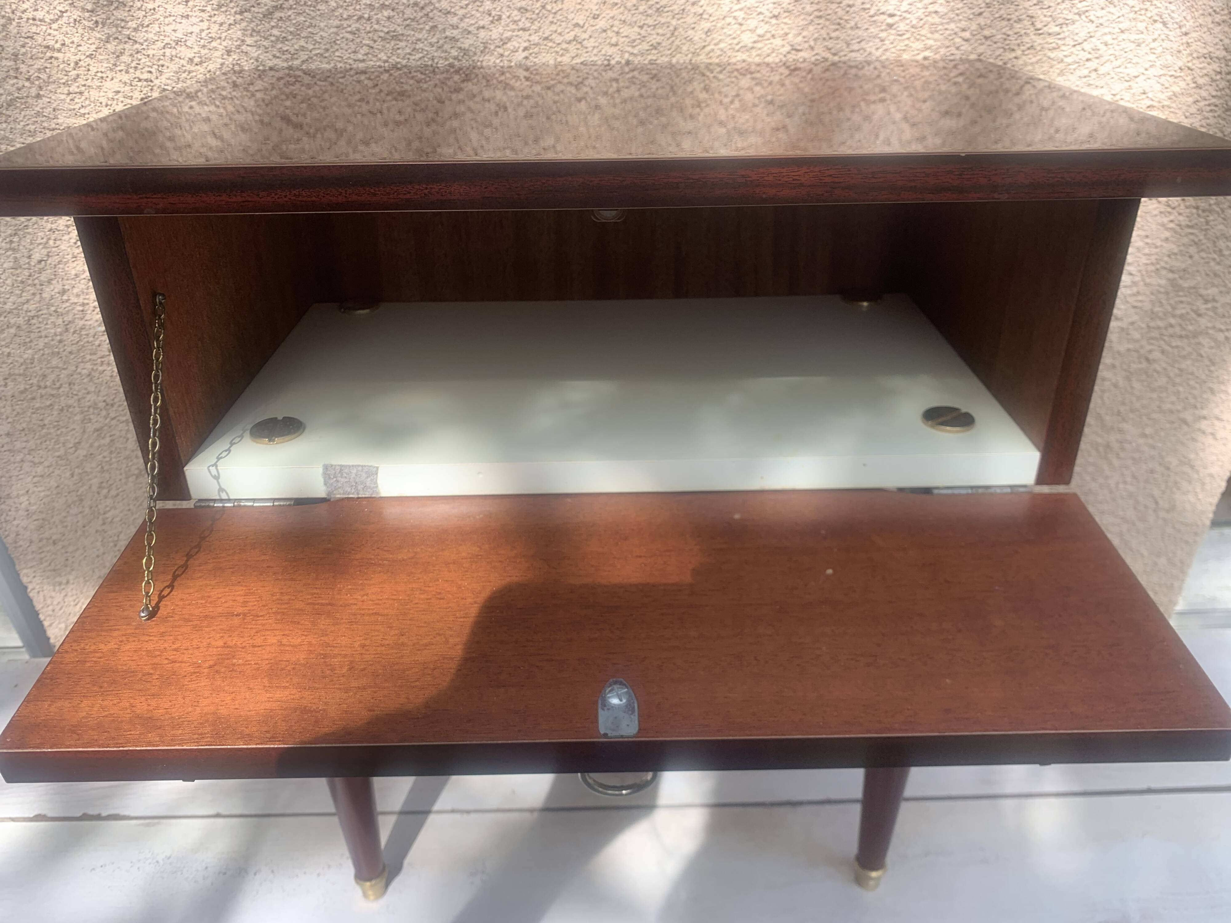 Nightstand with lovely mid-century style gold metal decor.