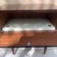 Nightstand with lovely mid-century style gold metal decor.