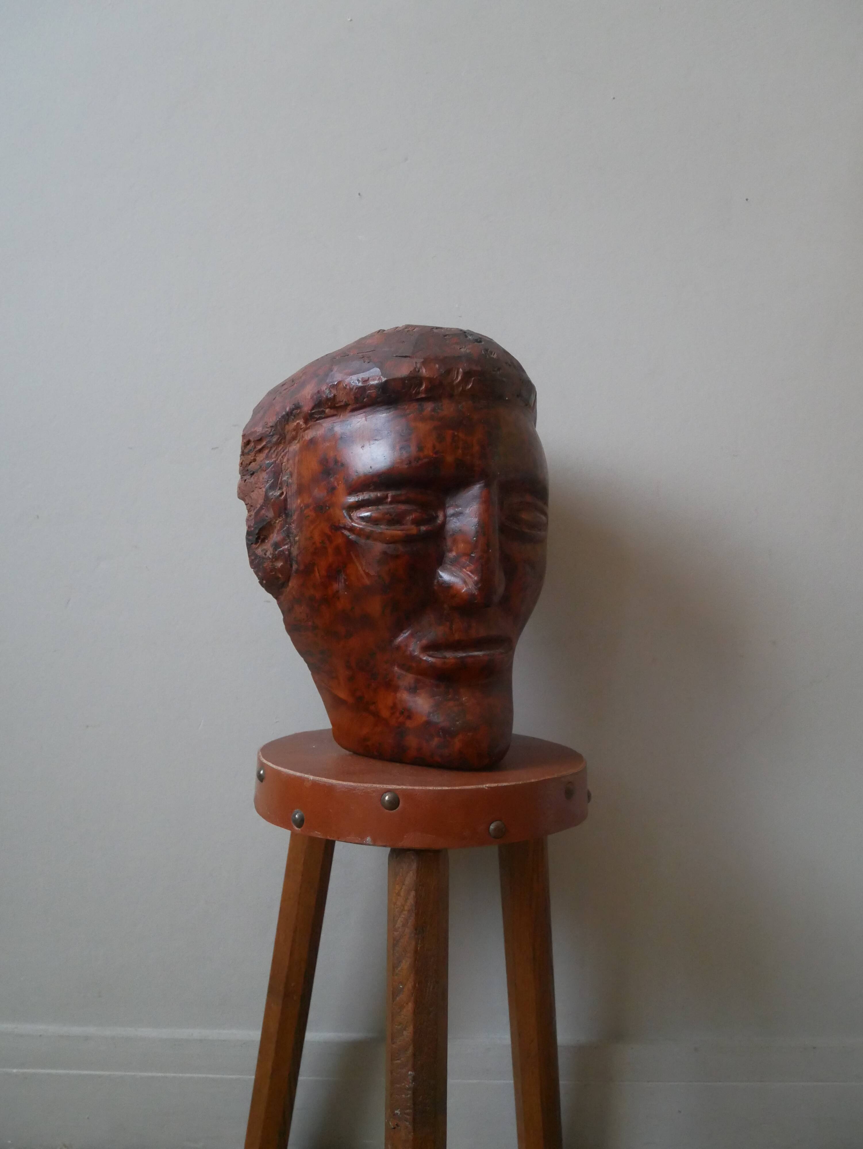 Wooden sculpture ethnic man's head handcrafted tribal decorative object workshop