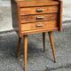 Scandinavian bedside table in oak from the 1960s with tapered legs and 3 drawers.