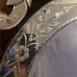 Oval Venetian mirror with close-bezel, early 20th century, flower decoration
