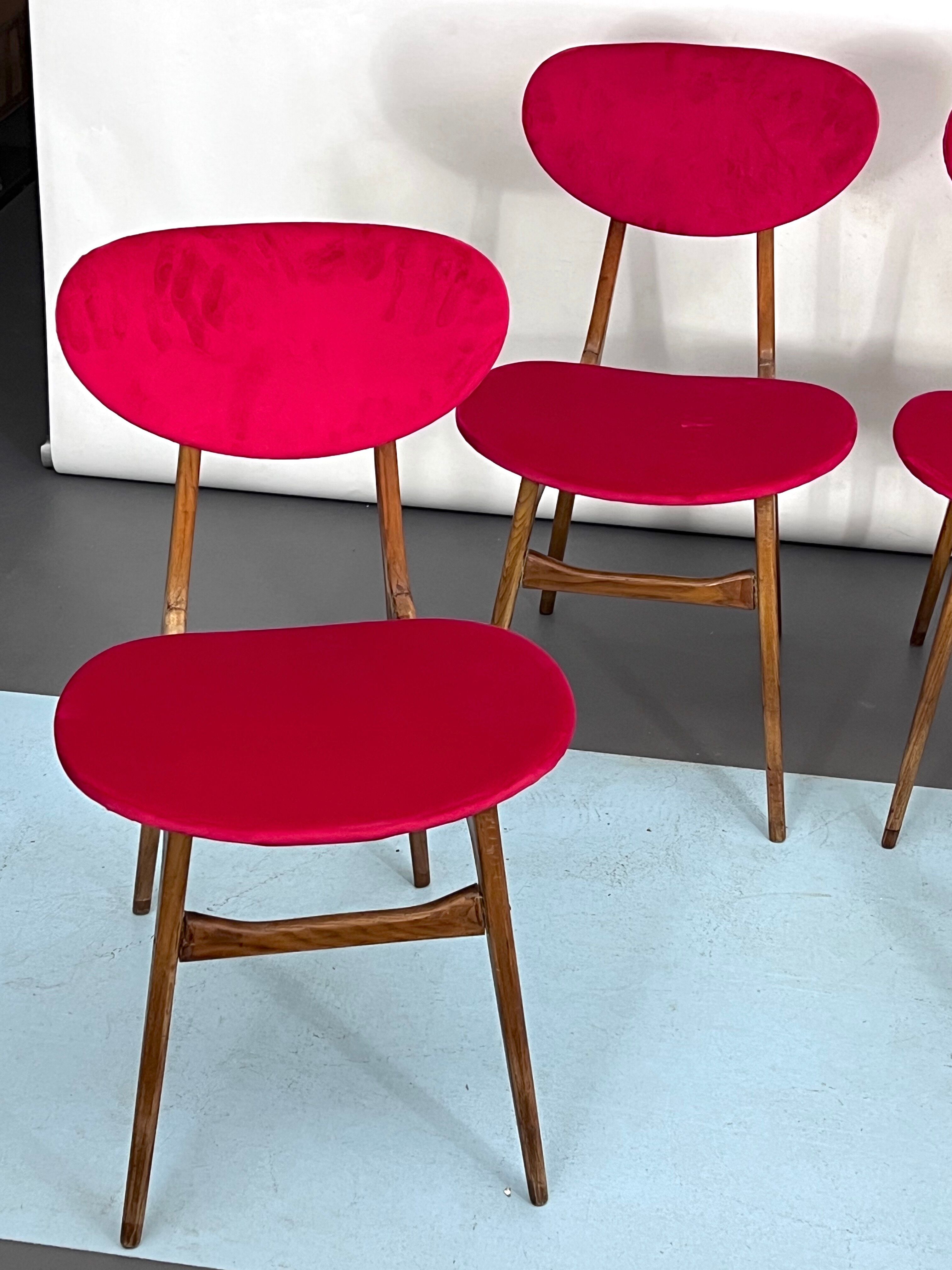Set of four red velvet and wood dining chairs, Italy 1950