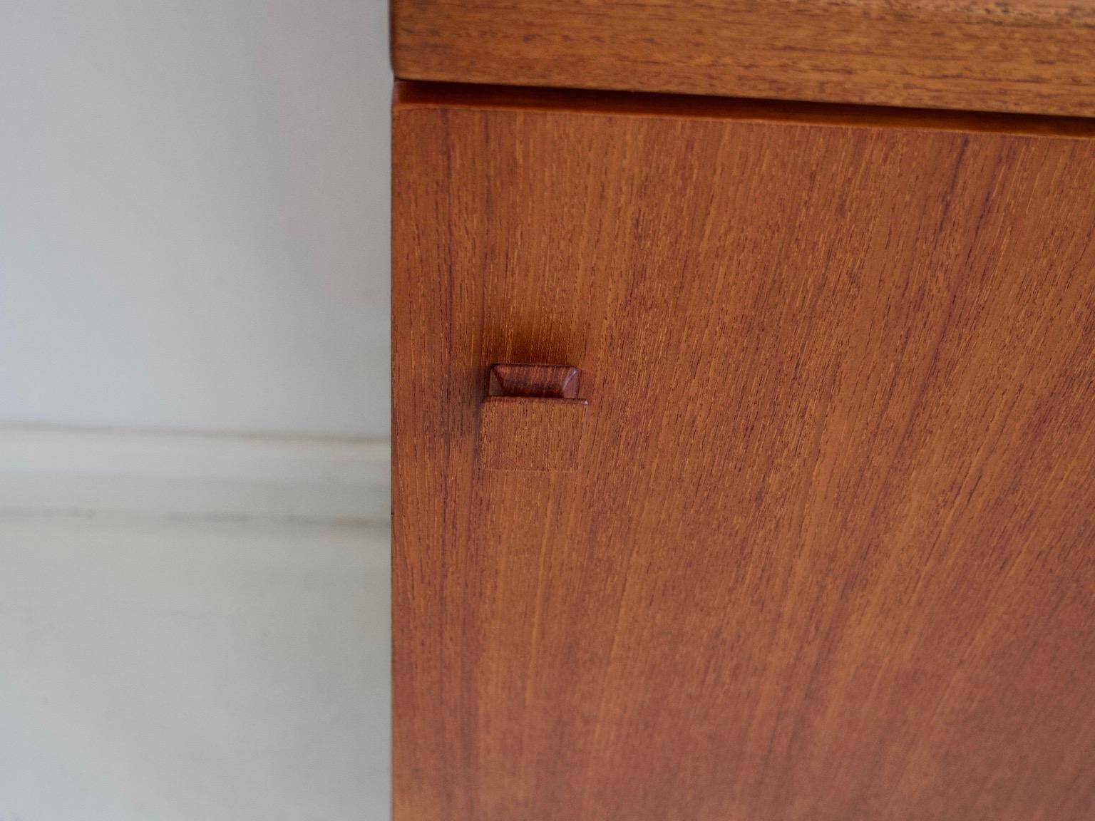 Modern mid-century teak sideboard with brass details.