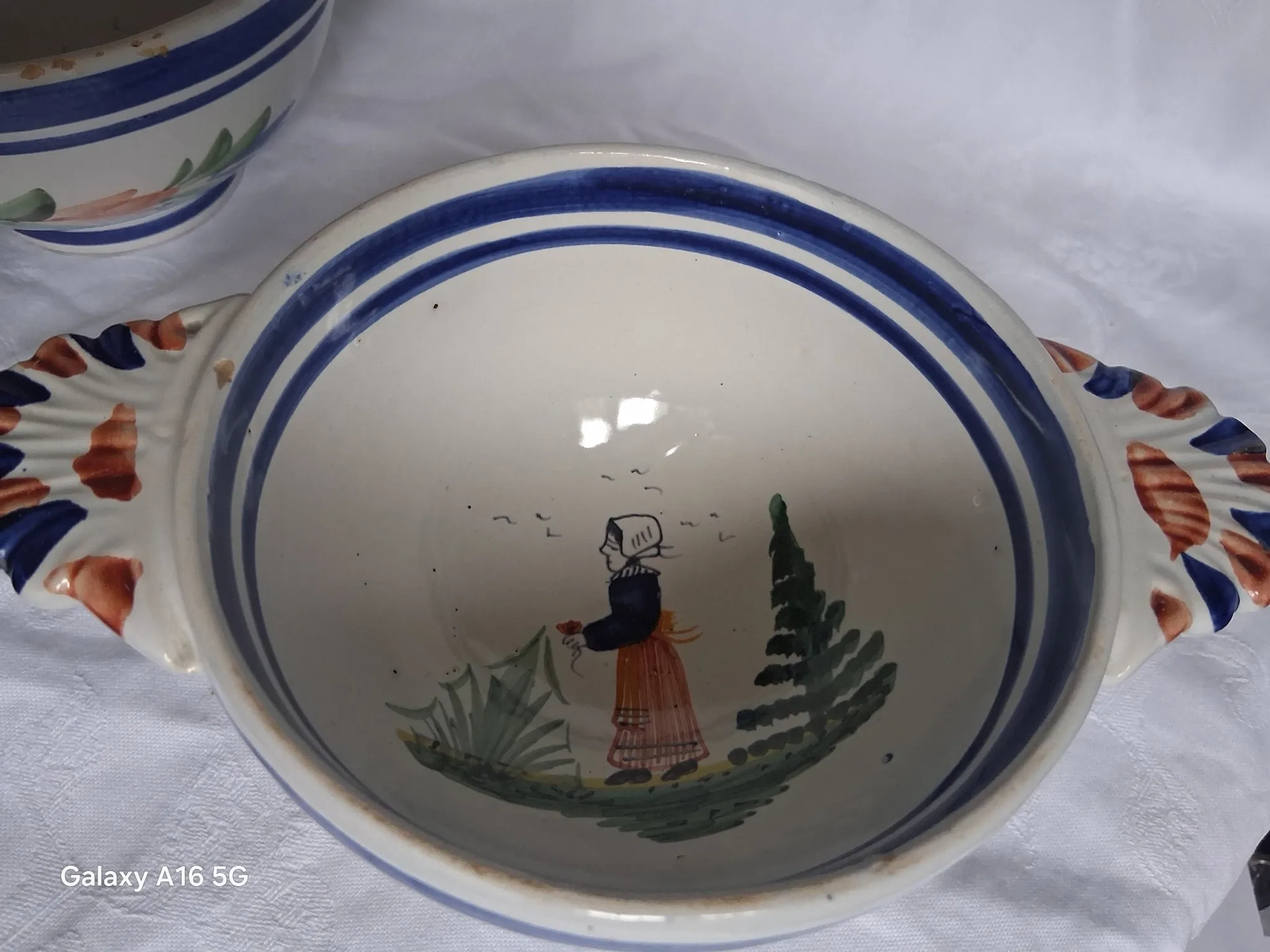 Set of three antique earthenware bowls from HB Quimper, signed.