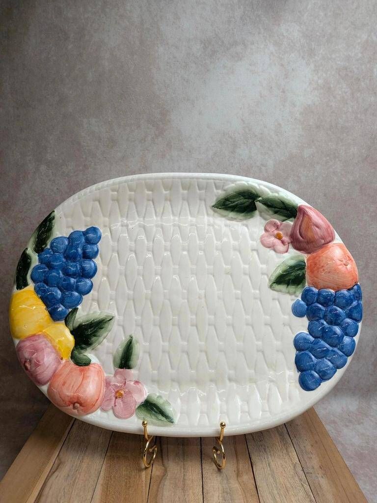 Vintage oval serving dish in majolica – Relief fruit decoration and woven basket design.