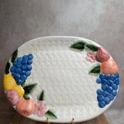 Vintage oval serving dish in majolica – Relief fruit decoration and woven basket design.