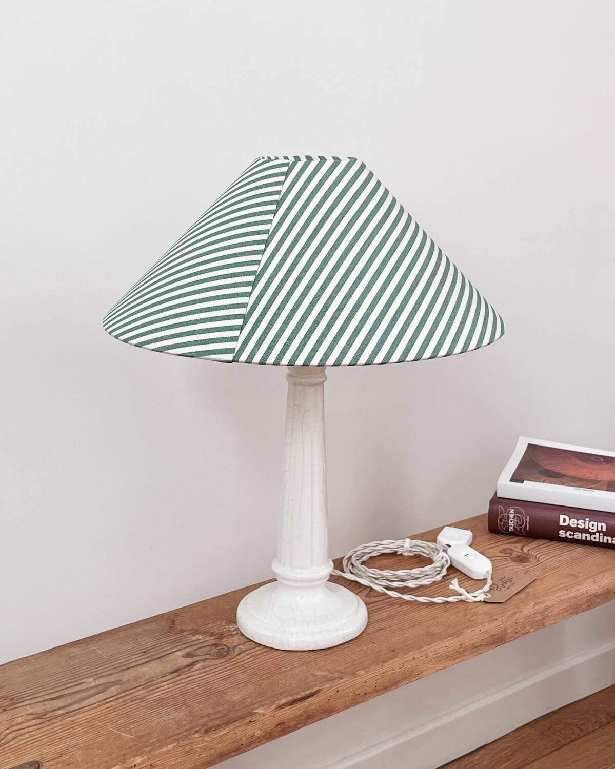Earthenware lamp and striped lampshade