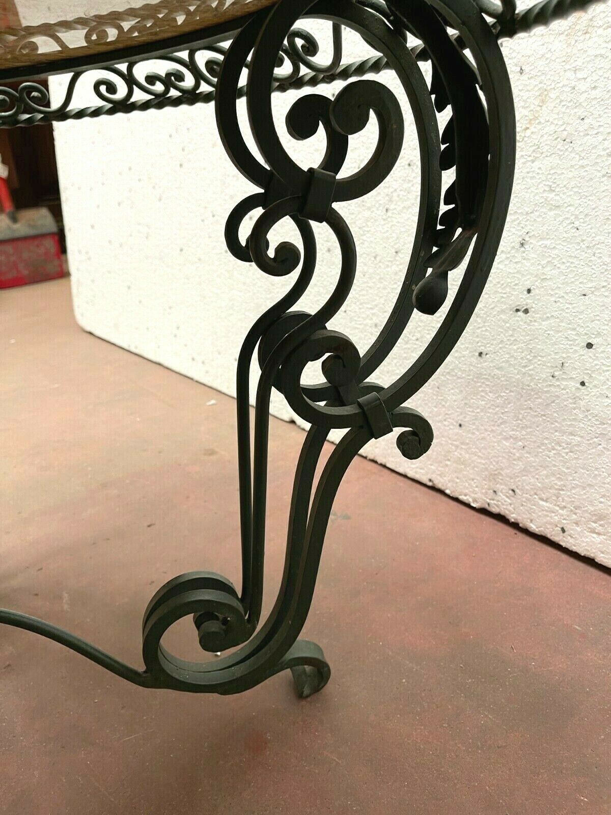 Round living room table in wrought iron and marble XX century