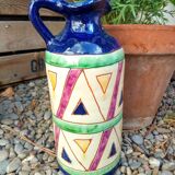 Vintage ceramic pitcher with geometric patterns