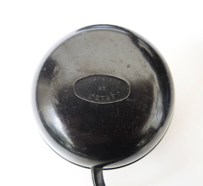 Old ptt phone with rotary dial in black bakelite