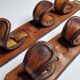 Pair of game bags in saddle leather and brass, old, 3 hooks, 57 cm