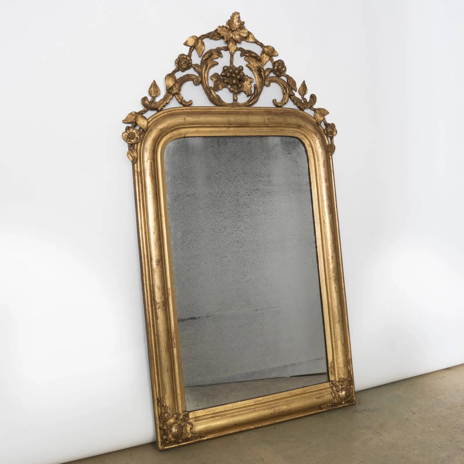 Louis-Philippe mirror from the 19th century with foliage and grape cluster motifs.