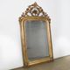 Louis-Philippe mirror from the 19th century with foliage and grape cluster motifs.