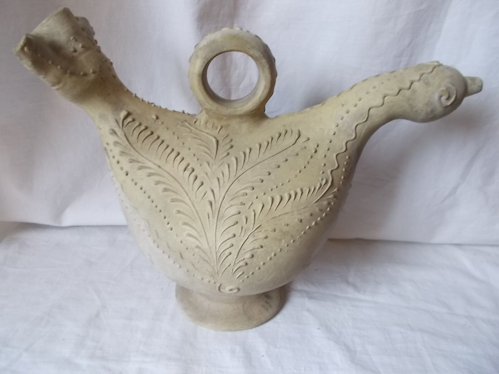 Old grey terracotta jug
