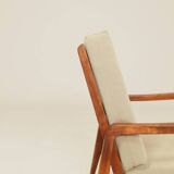 Vintage armchair in olive corduroy with a wooden frame.