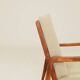 Vintage armchair in olive corduroy with a wooden frame.