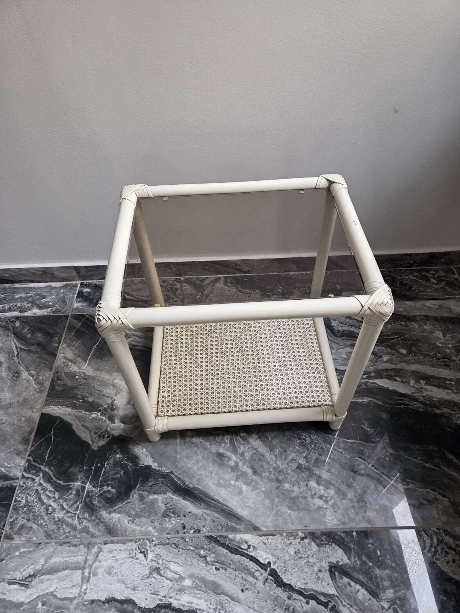 Rattan and cane side table with tinted glass top