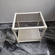Rattan and cane side table with tinted glass top