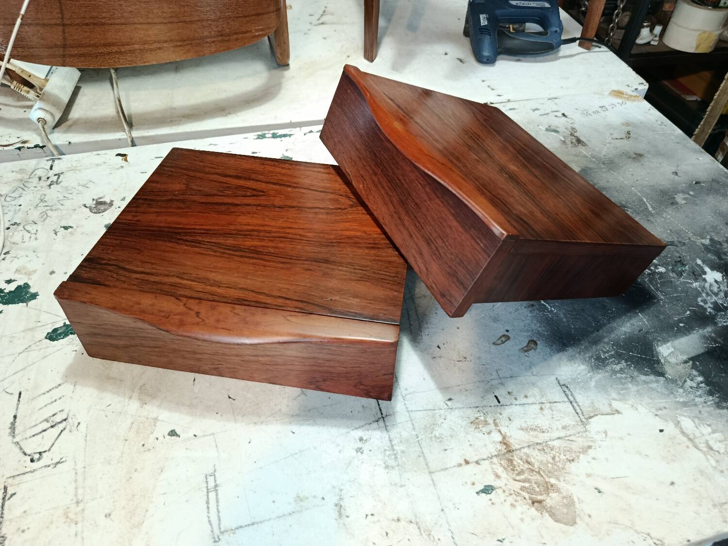 Scandinavian suspended bedside tables in rosewood.