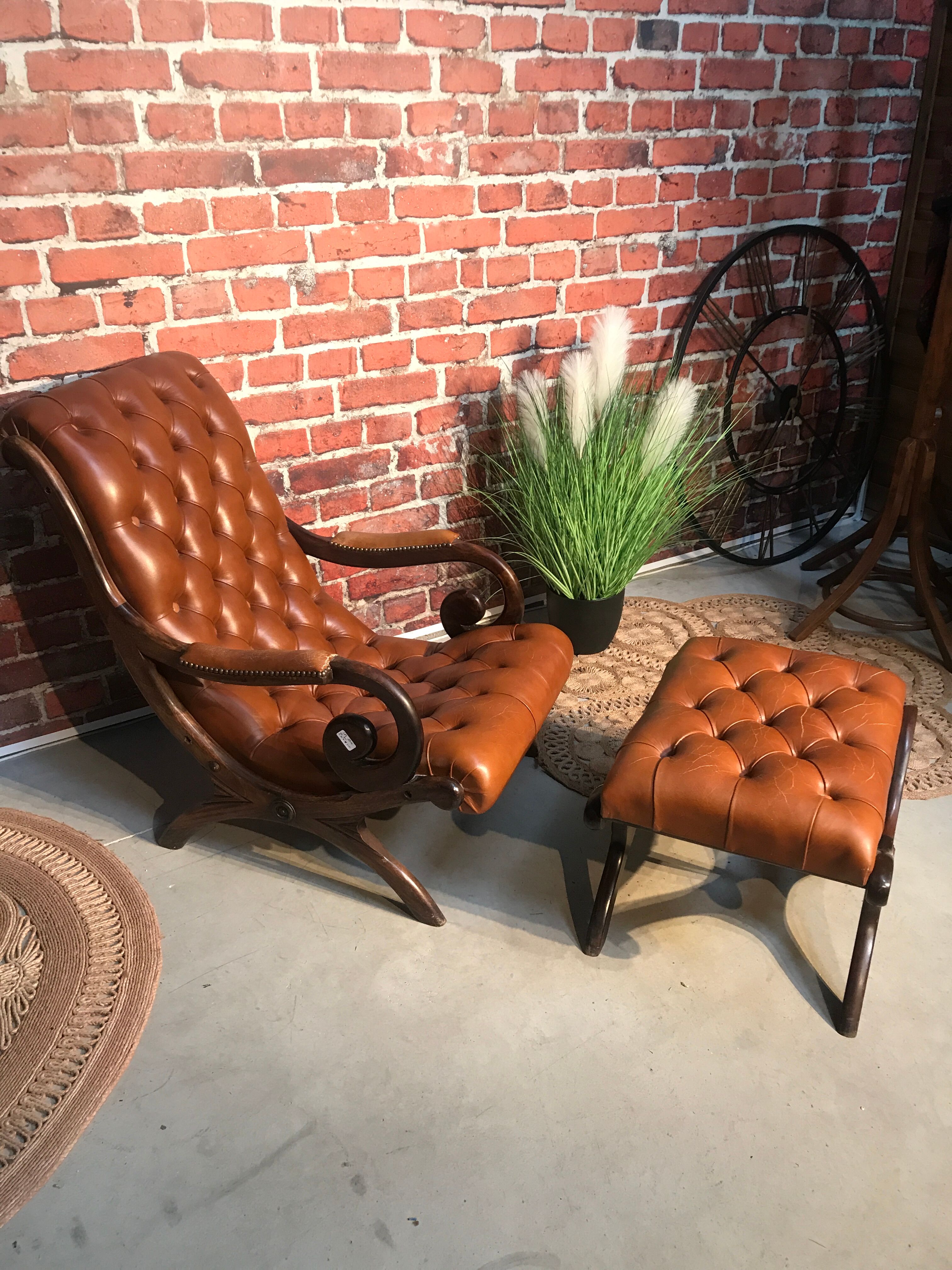 Chair padded and are resting foot.