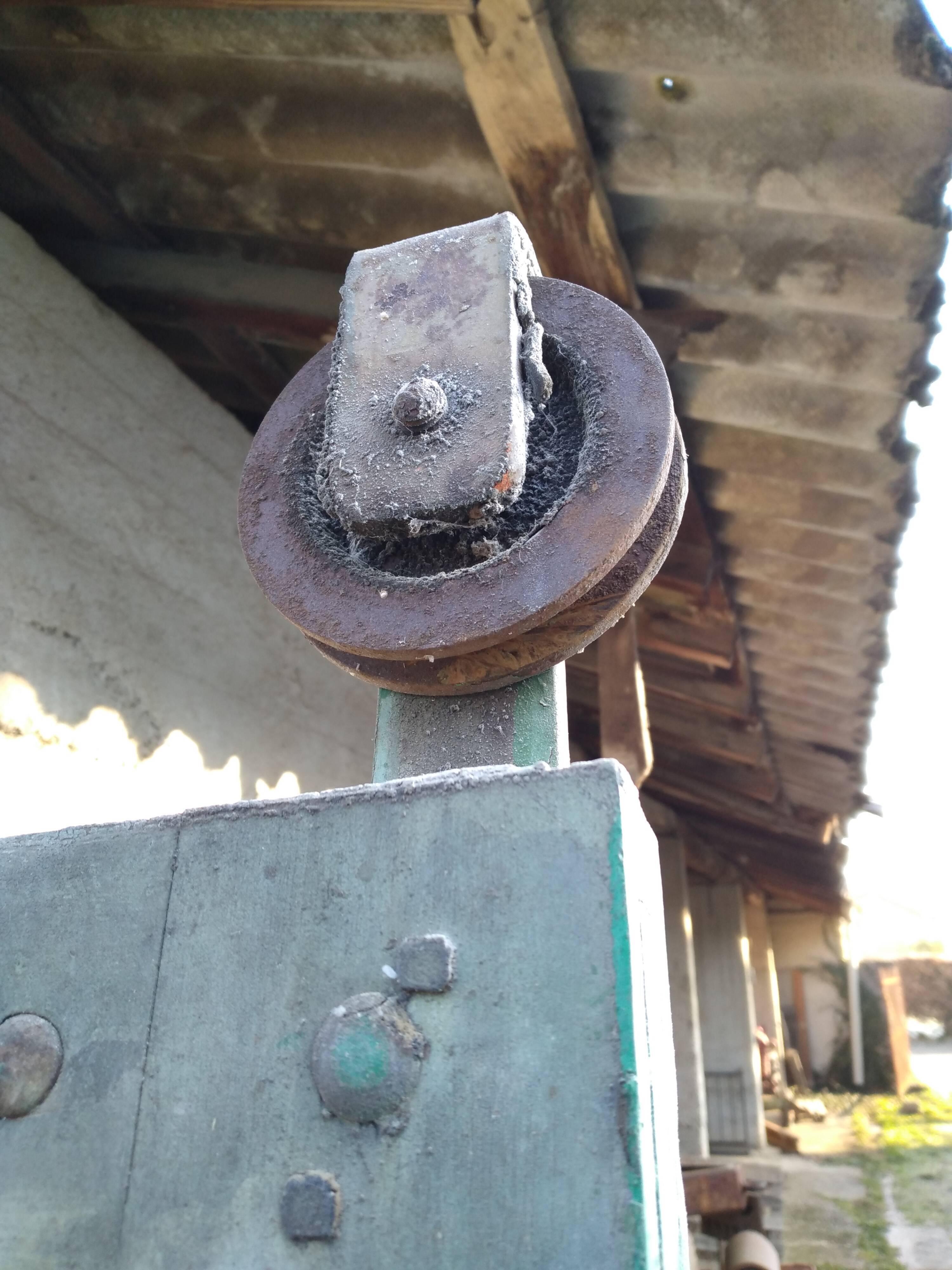 Old wooden door with pulley