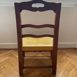 Low chair in wood and woven straw
