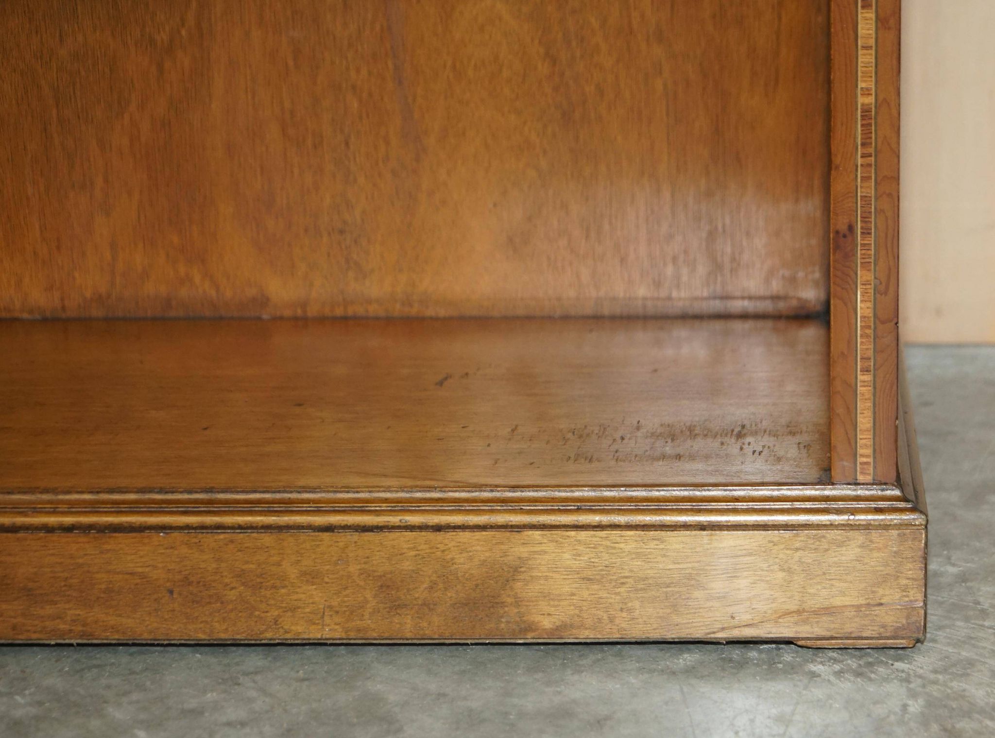 Pair of Sheraton Revival bookcases in satinwood, walnut, and yew.