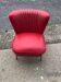 Mid-century cocktail chair in red vinyl and beech, ribbed backrest, 1950s.