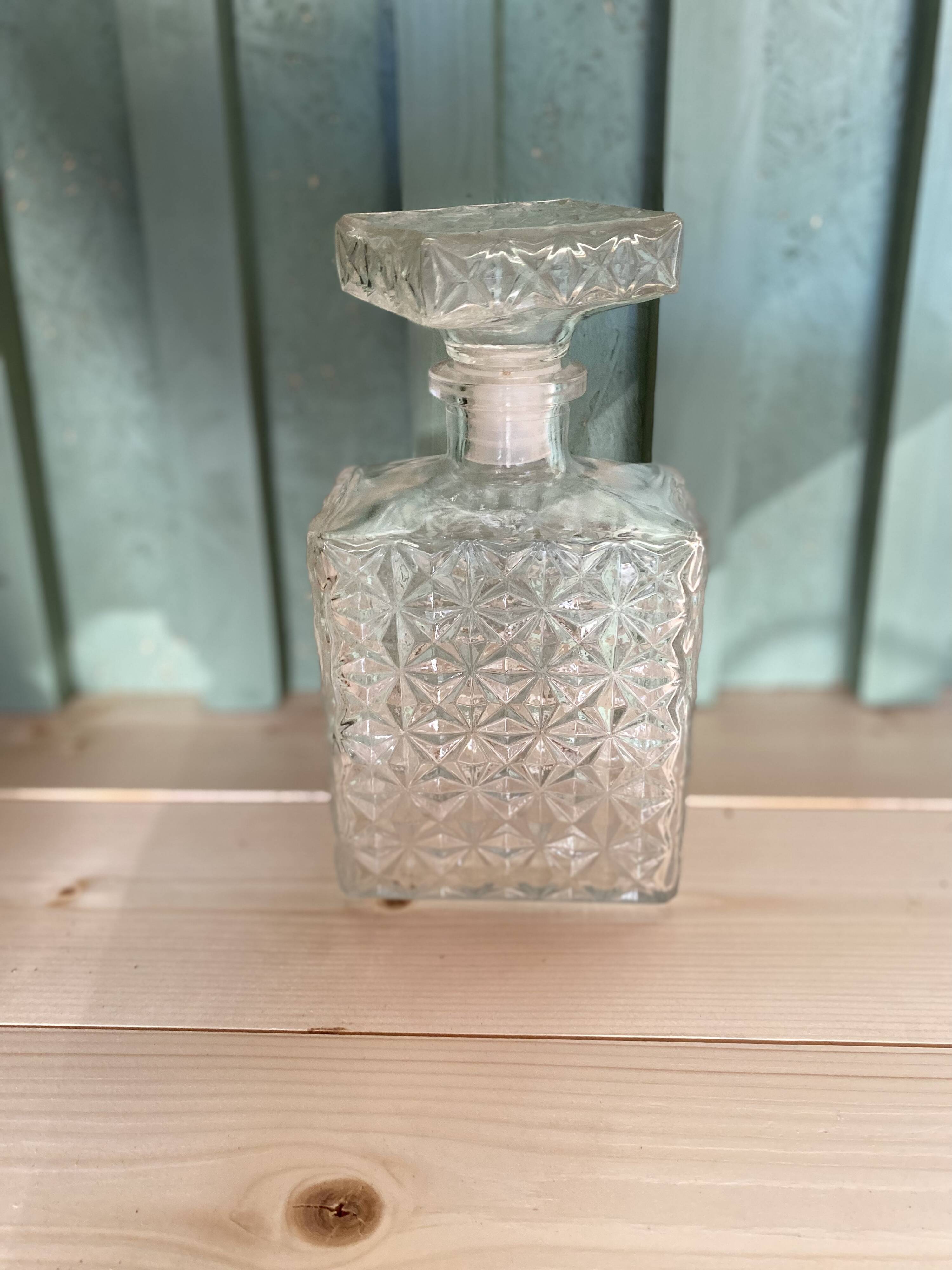 Old molded glass whiskey bottle