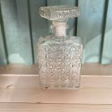 Old molded glass whiskey bottle