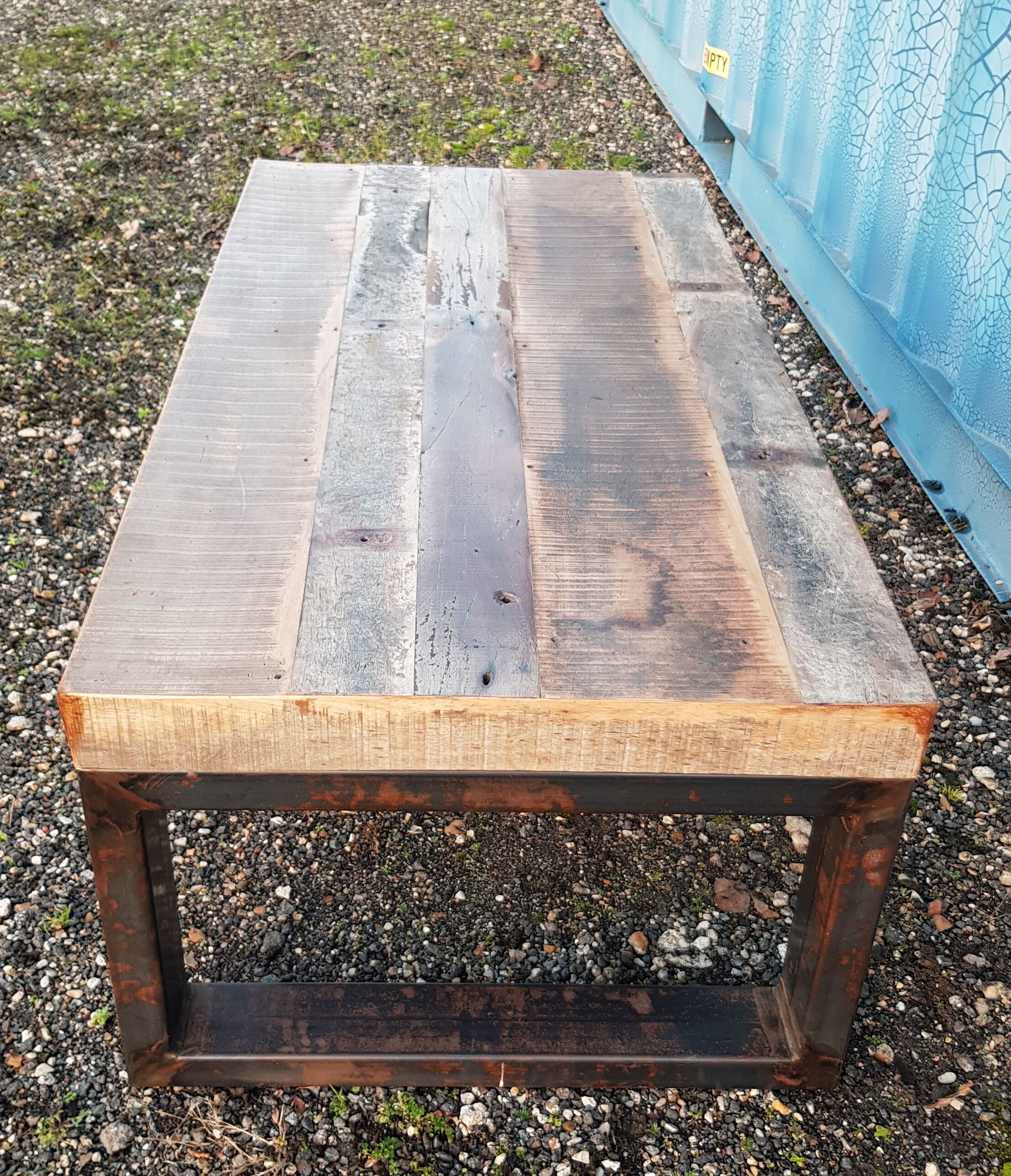 Industrial coffee table with wooden top and metal legs