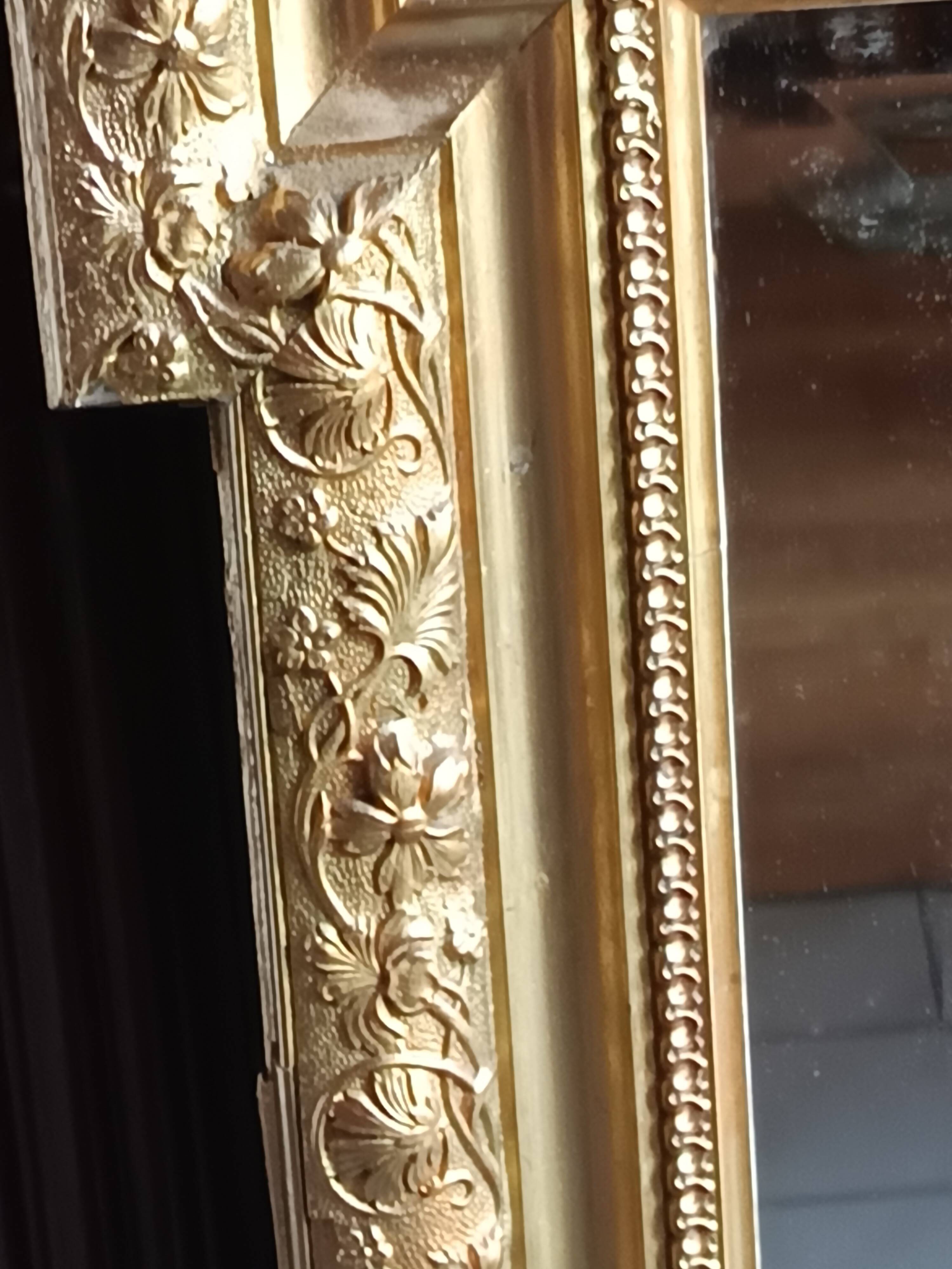Antique mirror in wood and gilded stucco, neo Louis XVI style.