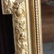 Antique mirror in wood and gilded stucco, neo Louis XVI style.