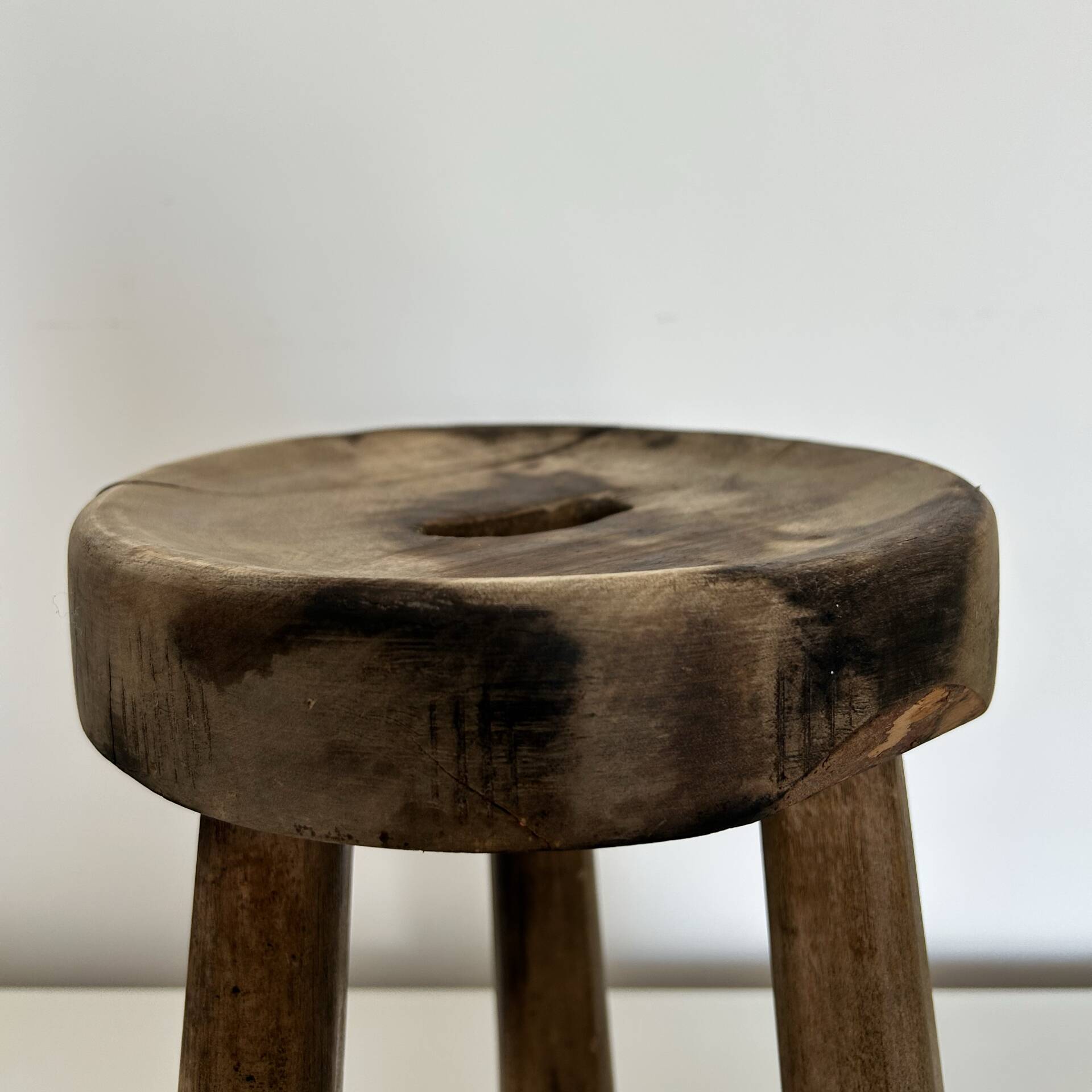 Patinated tripod stool
