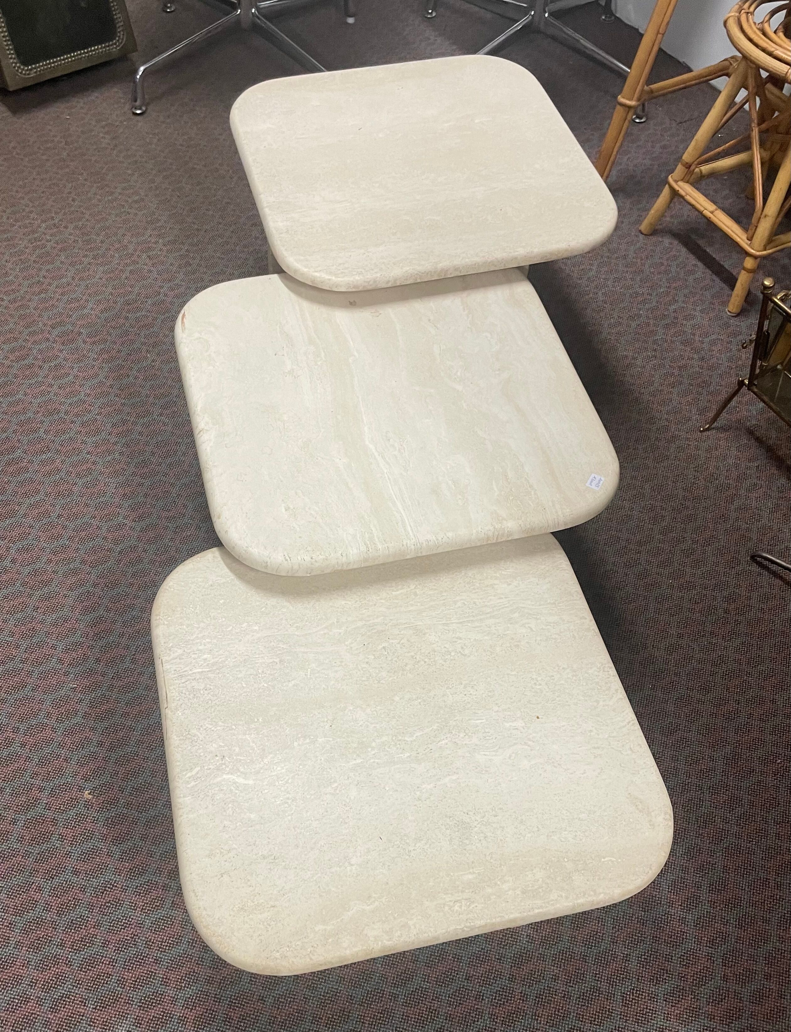 Modular pull-out coffee tables in travertine