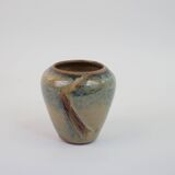 Small beige glazed ceramic vase with abstract relief pattern