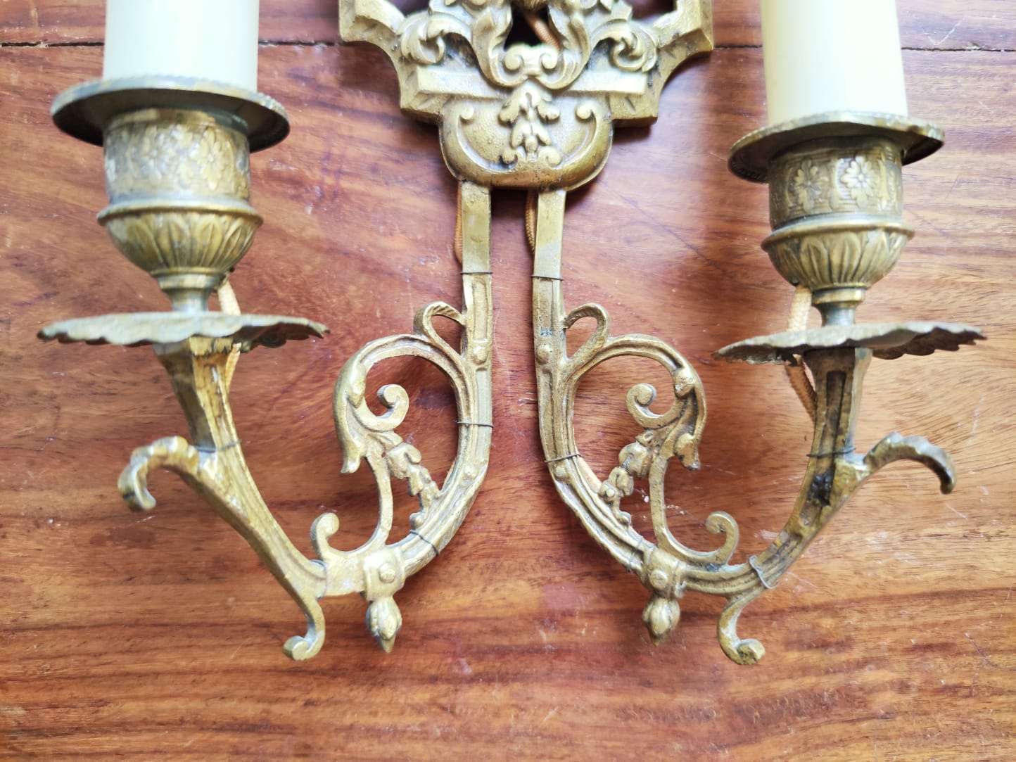 Pair of gilded bronze sconces decorated with Louis XIV style mascarons