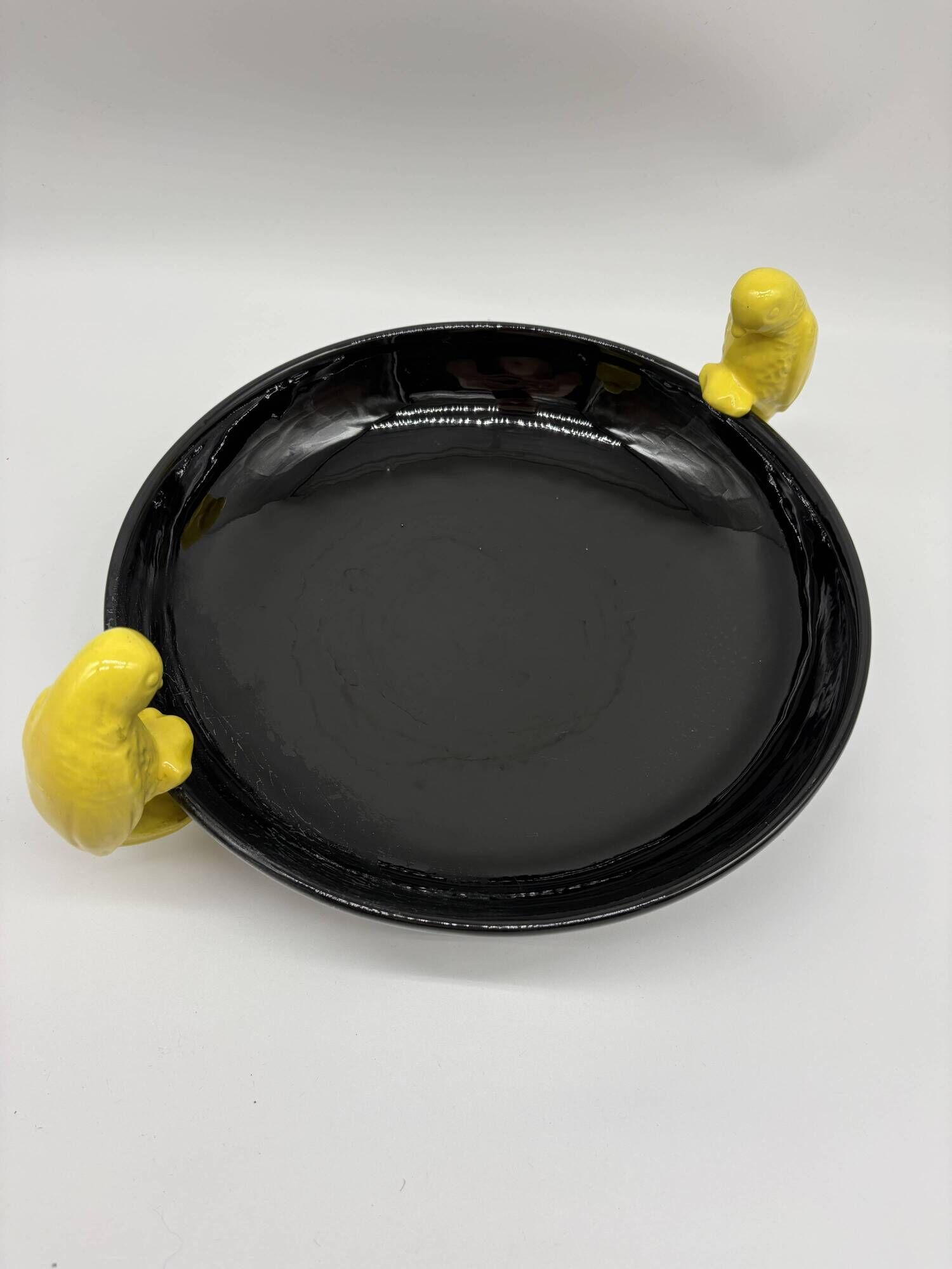 Large vintage black ceramic bowl with yellow parakeets, Vallauris.