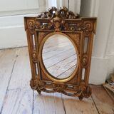 Old small golden mirror